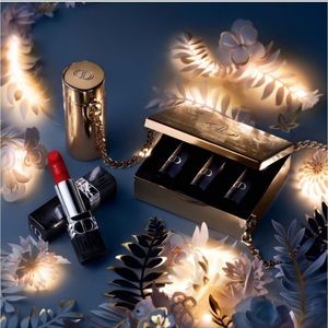 Brand new Dior clutch with lipsticks